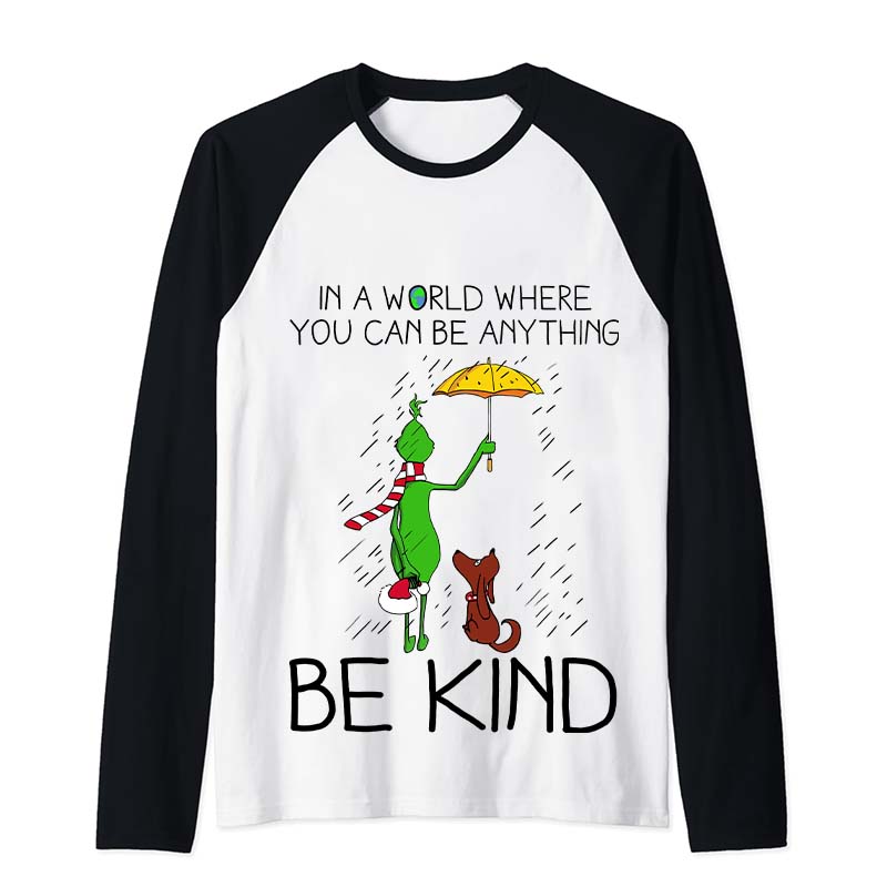In A World Where You Can Be Anything Be Kind Teacher Raglan Long Sleeve T-Shirt