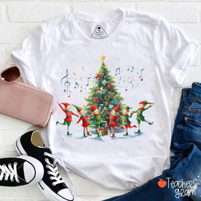 Elves Dancing Around The Christmas Tree Teacher T-Shirt