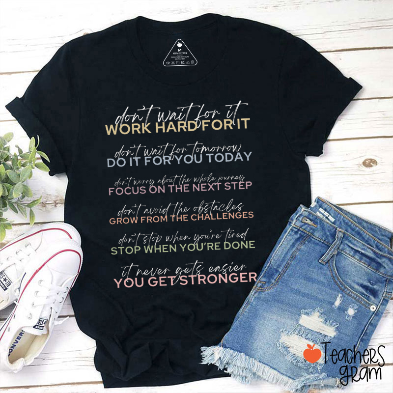 It Never Gets Easier You Get Stronger Teacher T-Shirt
