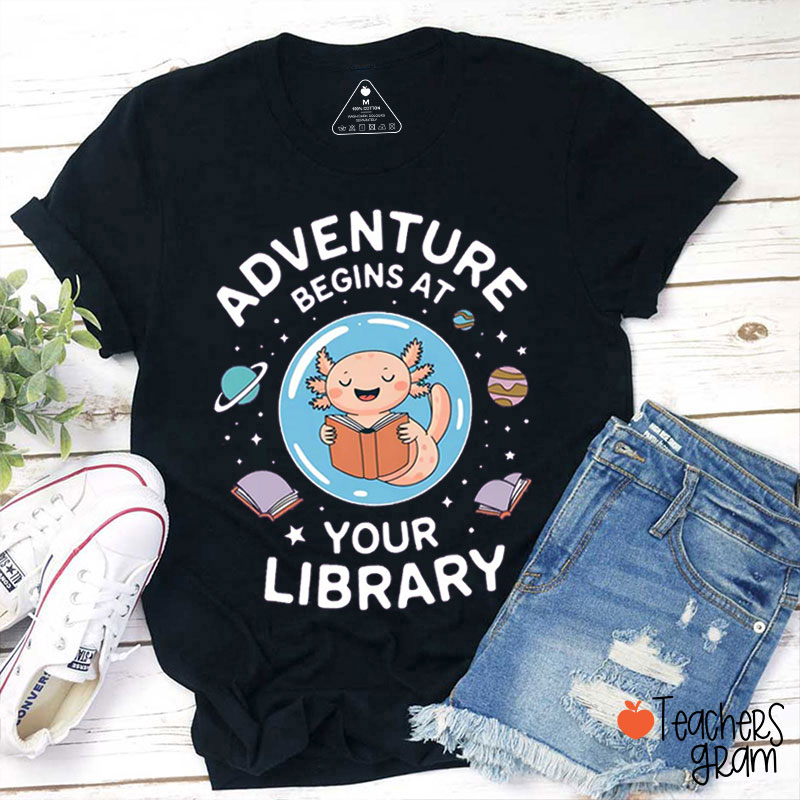 Adventure Begins At Your Library Teacher T-Shirt