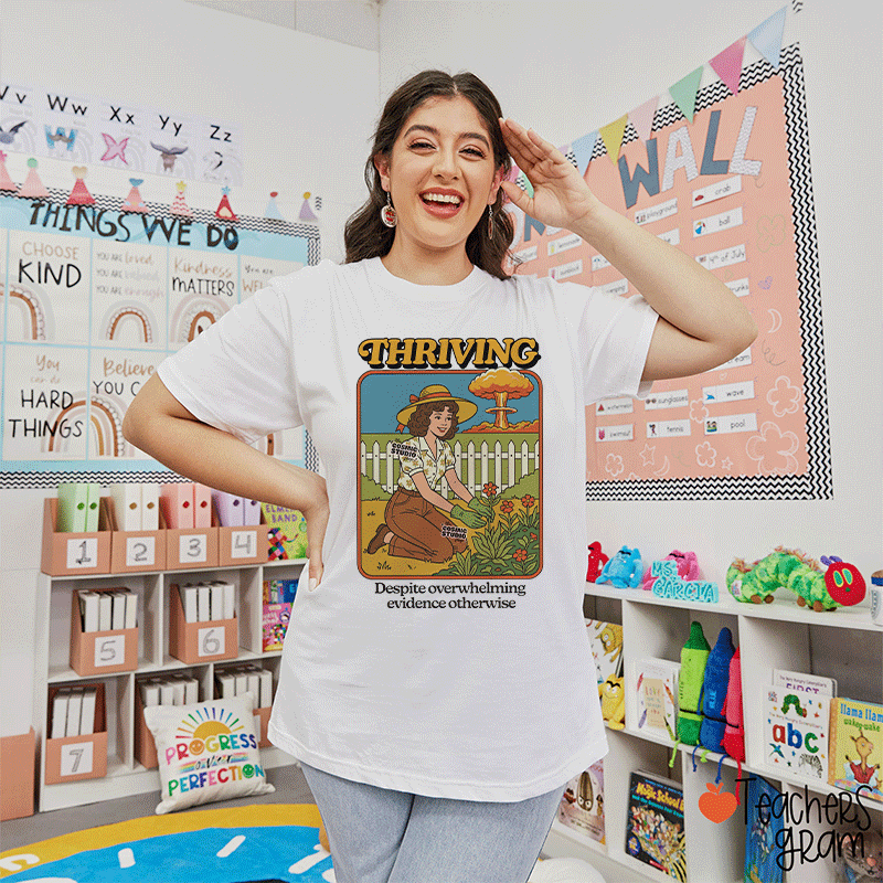 Thriving Despite Overwhelming Evidence Otherwise Teacher T-shirt