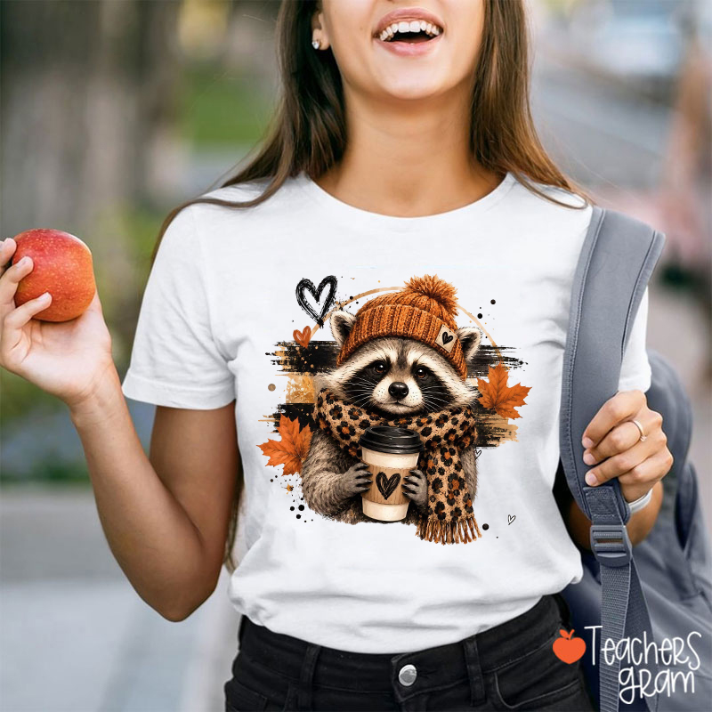 Cute Raccoon With Knit Hat Leopard Scarf Coffee And Fall Leaves Teacher T-Shirt