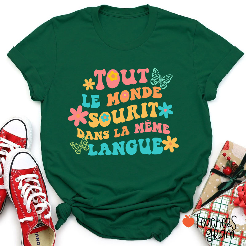 Tout Le Monde Sourit Dans La Même Langue French Teacher T-Shirt