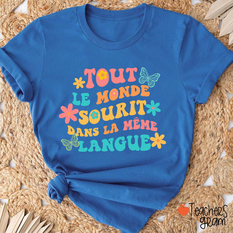 Tout Le Monde Sourit Dans La Même Langue French Teacher T-Shirt