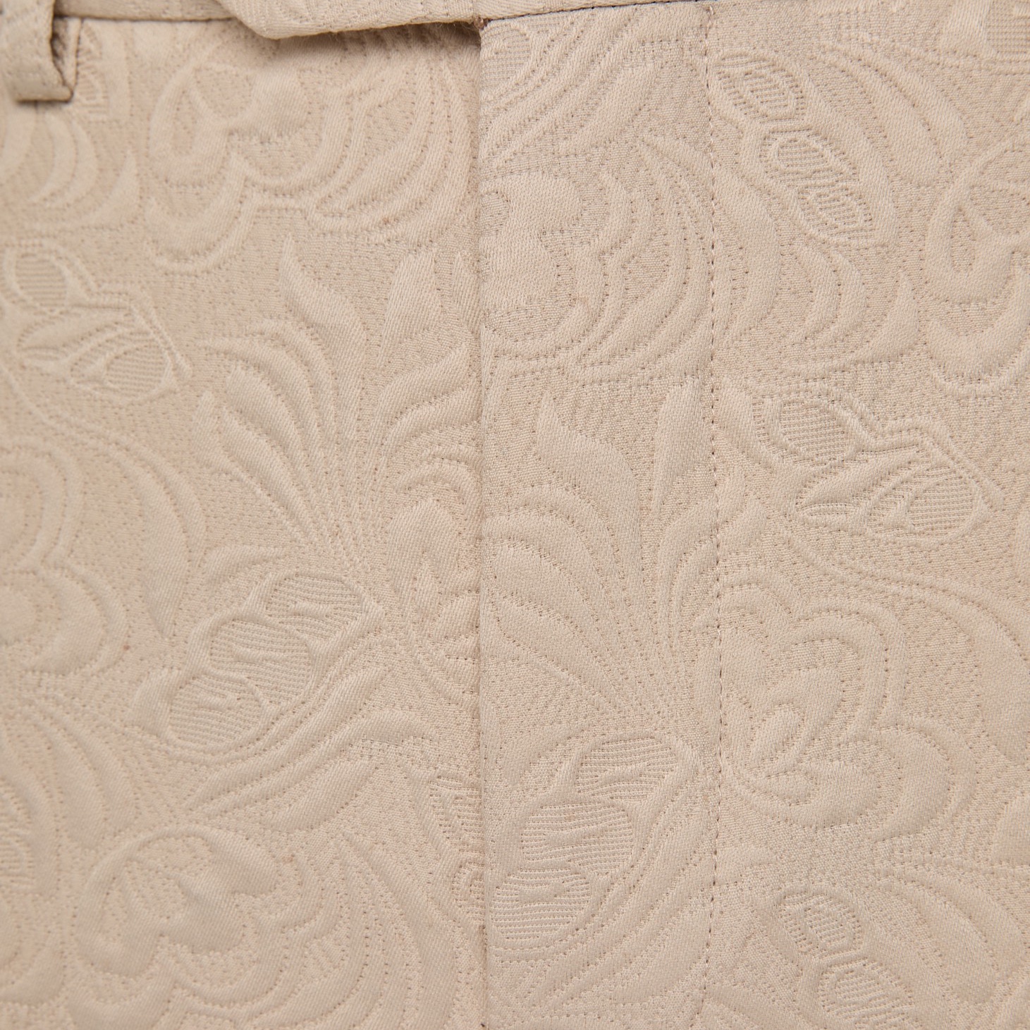 Front view of a men's beige jacquard double-breasted suit with black satin shawl lapel and matching trousers.