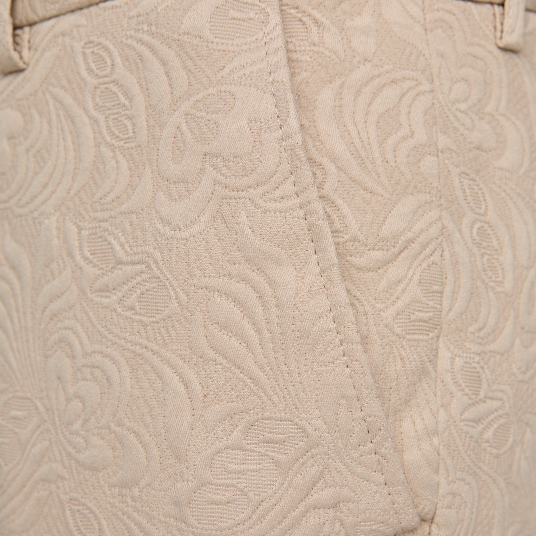 Front view of a men's beige jacquard double-breasted suit with black satin shawl lapel and matching trousers.
