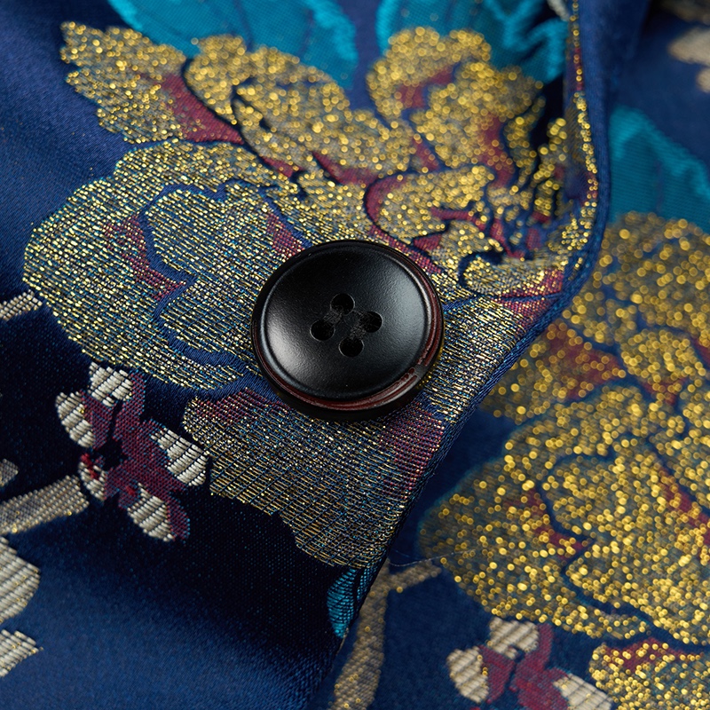 Men's blue floral brocade suit jacket with a one-button closure and intricate gold, teal, and red patterns.