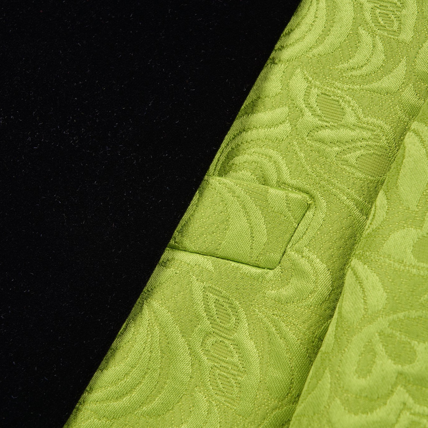 Front view of a men's lime green brocade 3-piece suit with black velvet shawl lapel and matching vest.