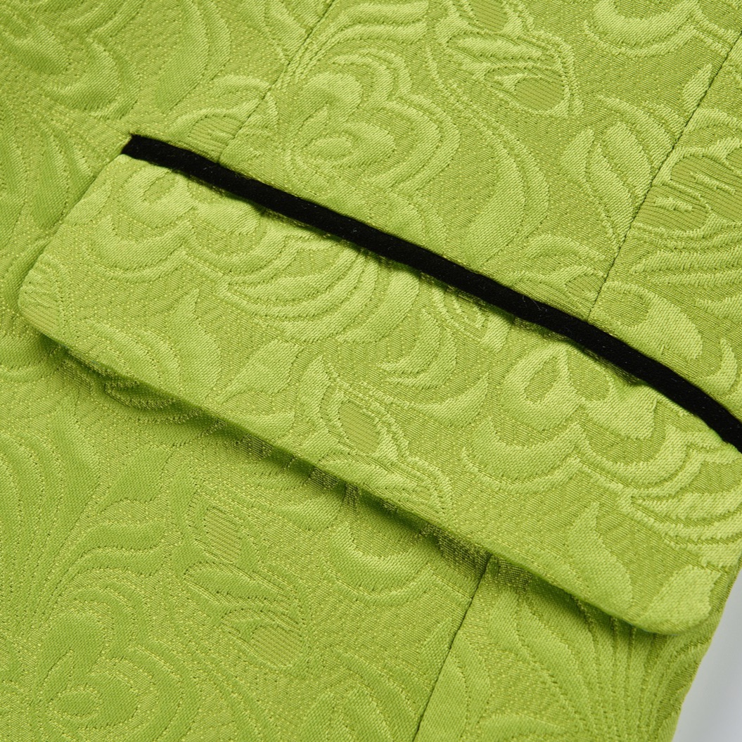 Front view of a men's lime green brocade 3-piece suit with black velvet shawl lapel and matching vest.