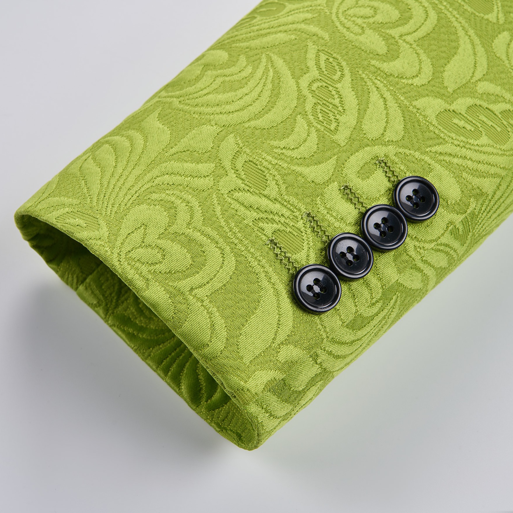 Front view of a men's lime green brocade 3-piece suit with black velvet shawl lapel and matching vest.