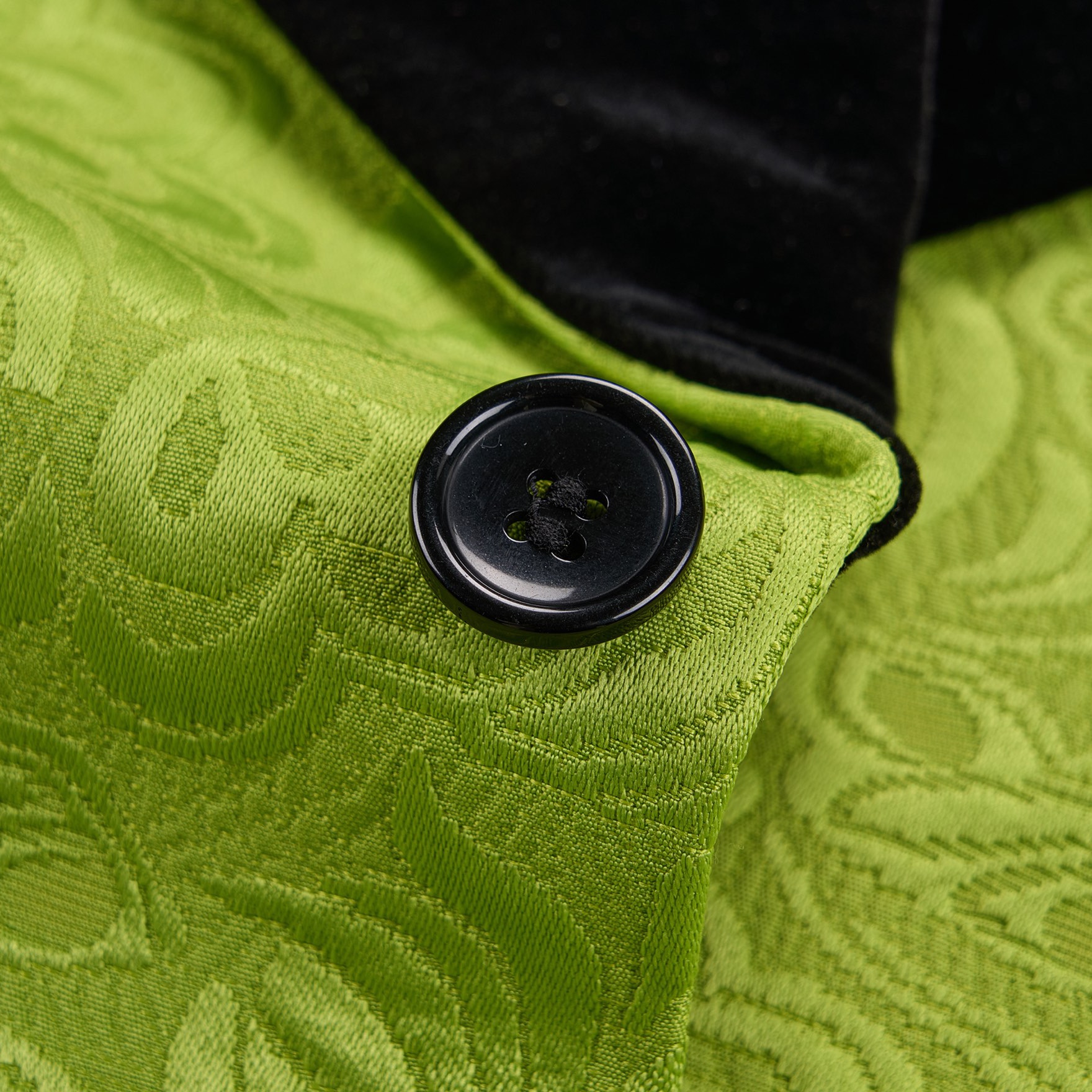 Front view of a men's lime green brocade 3-piece suit with black velvet shawl lapel and matching vest.