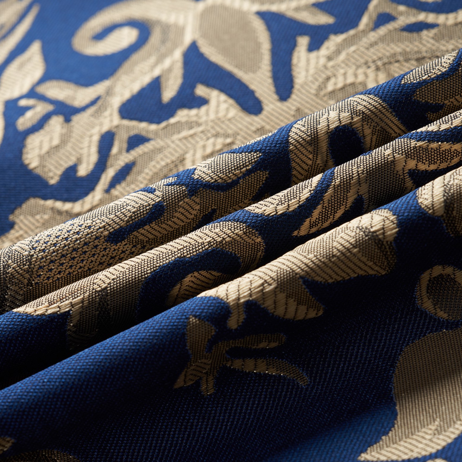 Front view of a men's blue and gold damask patterned blazer with black shawl lapels, one-button closure, and black trim