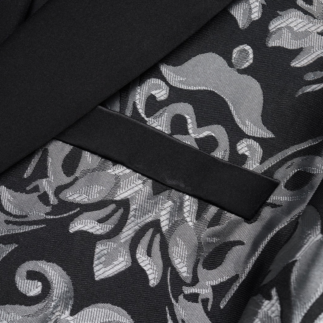 Front view of a men's black suit jacket with silver damask pattern and black satin shawl lapels.