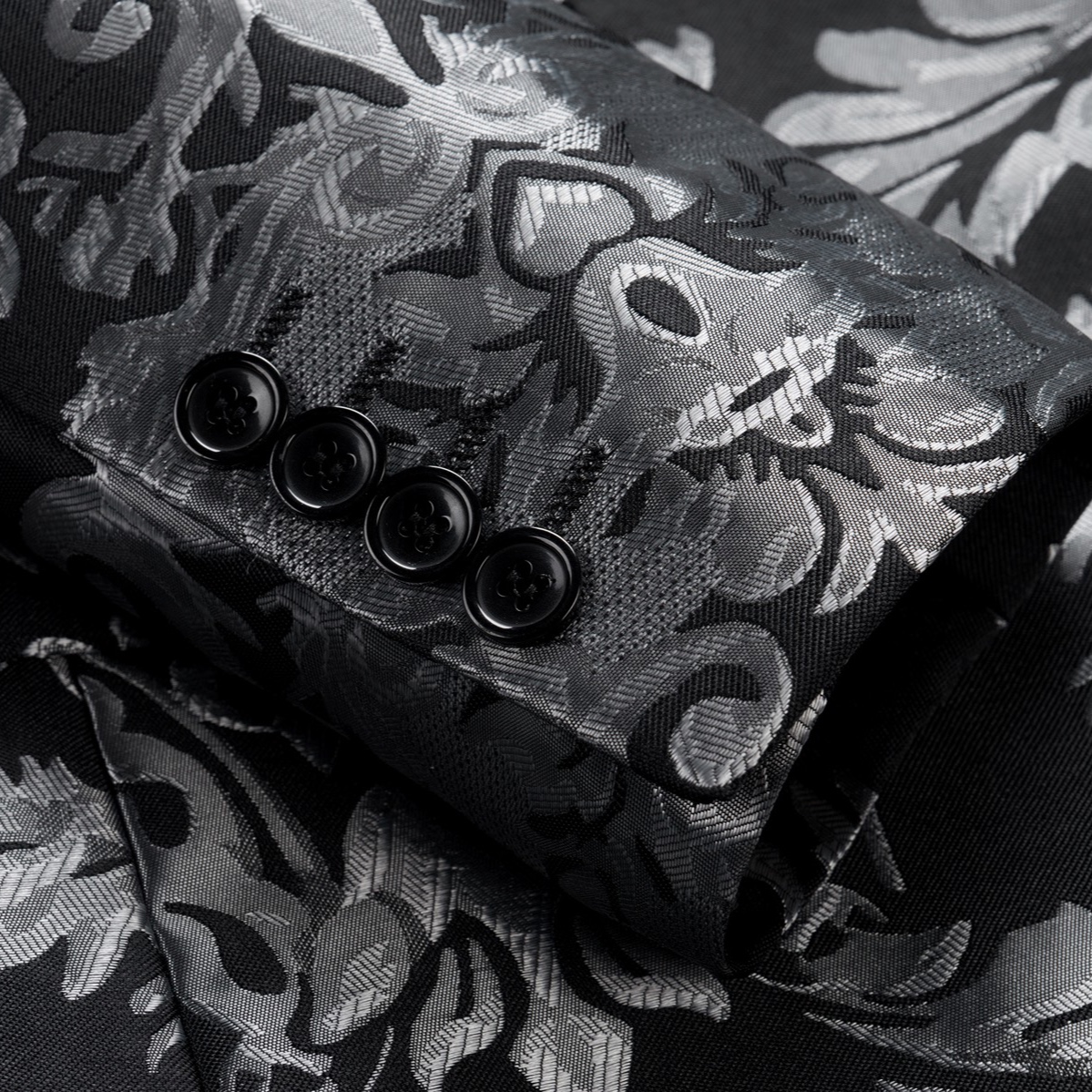Front view of a men's black suit jacket with silver damask pattern and black satin shawl lapels.
