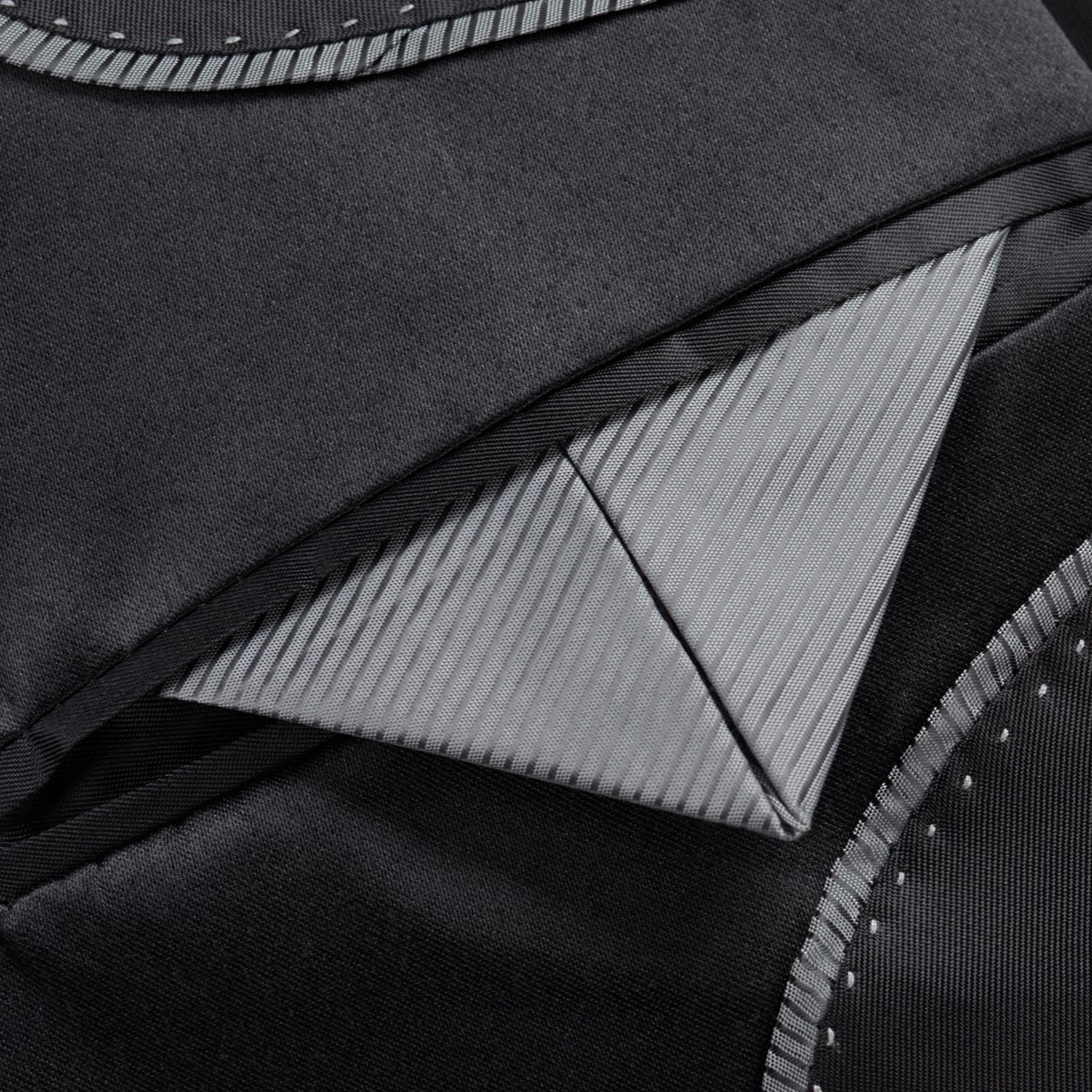Front view of a men's black suit jacket with silver damask pattern and black satin shawl lapels.