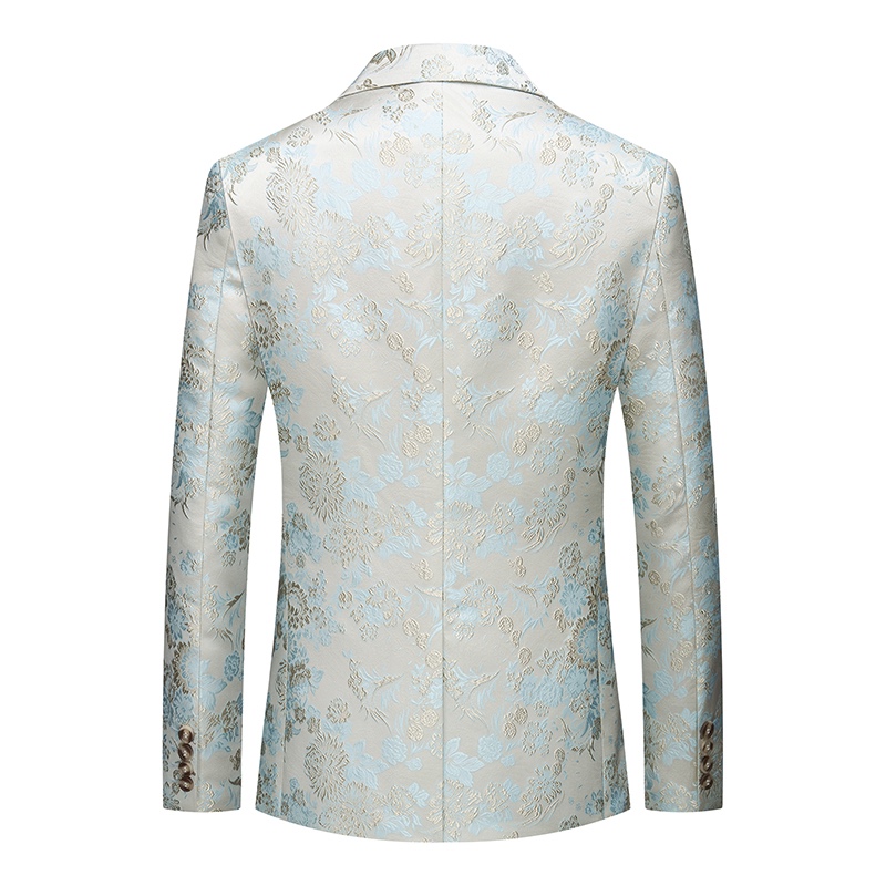 Close-up of a men's light blue and cream floral brocade suit jacket with a single marbled brown button.