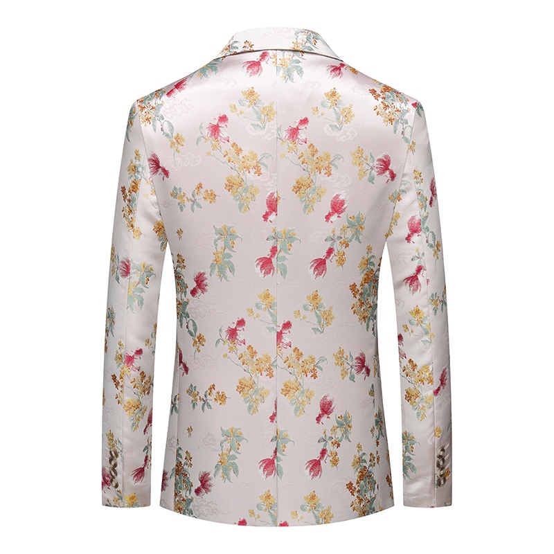 Close-up of a men's white jacquard suit jacket with red, yellow, and green floral patterns, showing the one-button closure