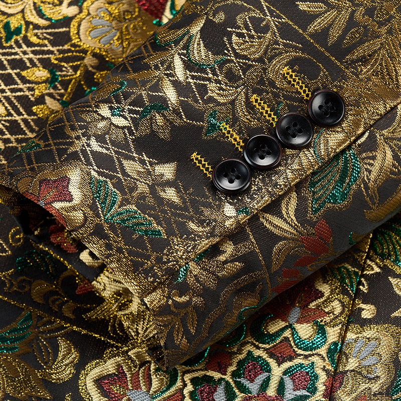 Back view of a men's gold brocade blazer with intricate floral and geometric patterns in red, green, and blue accents.