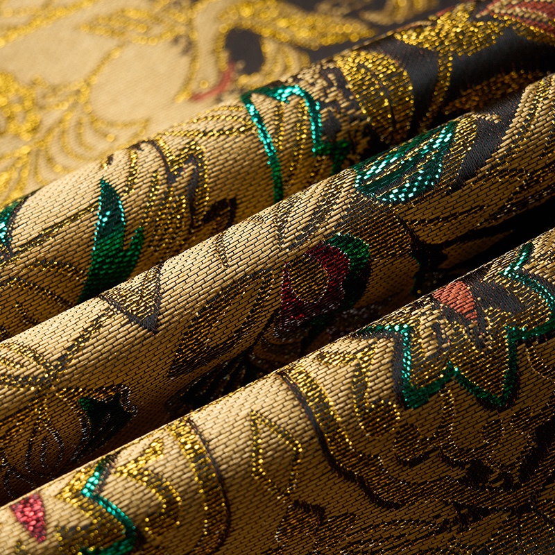 Front view of a men's gold jacquard blazer with green and purple mythical creature patterns, featuring a single black button
