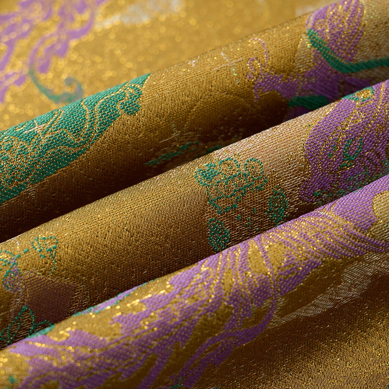 Front view of a men's gold jacquard blazer with green and purple mythical creature patterns, featuring a single black button