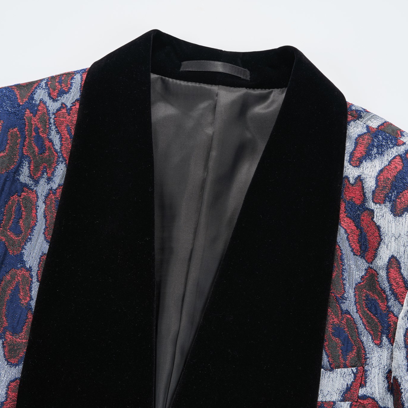 Front view of a men's red, blue, and silver leopard print jacquard blazer with a black velvet shawl lapel and a single-button