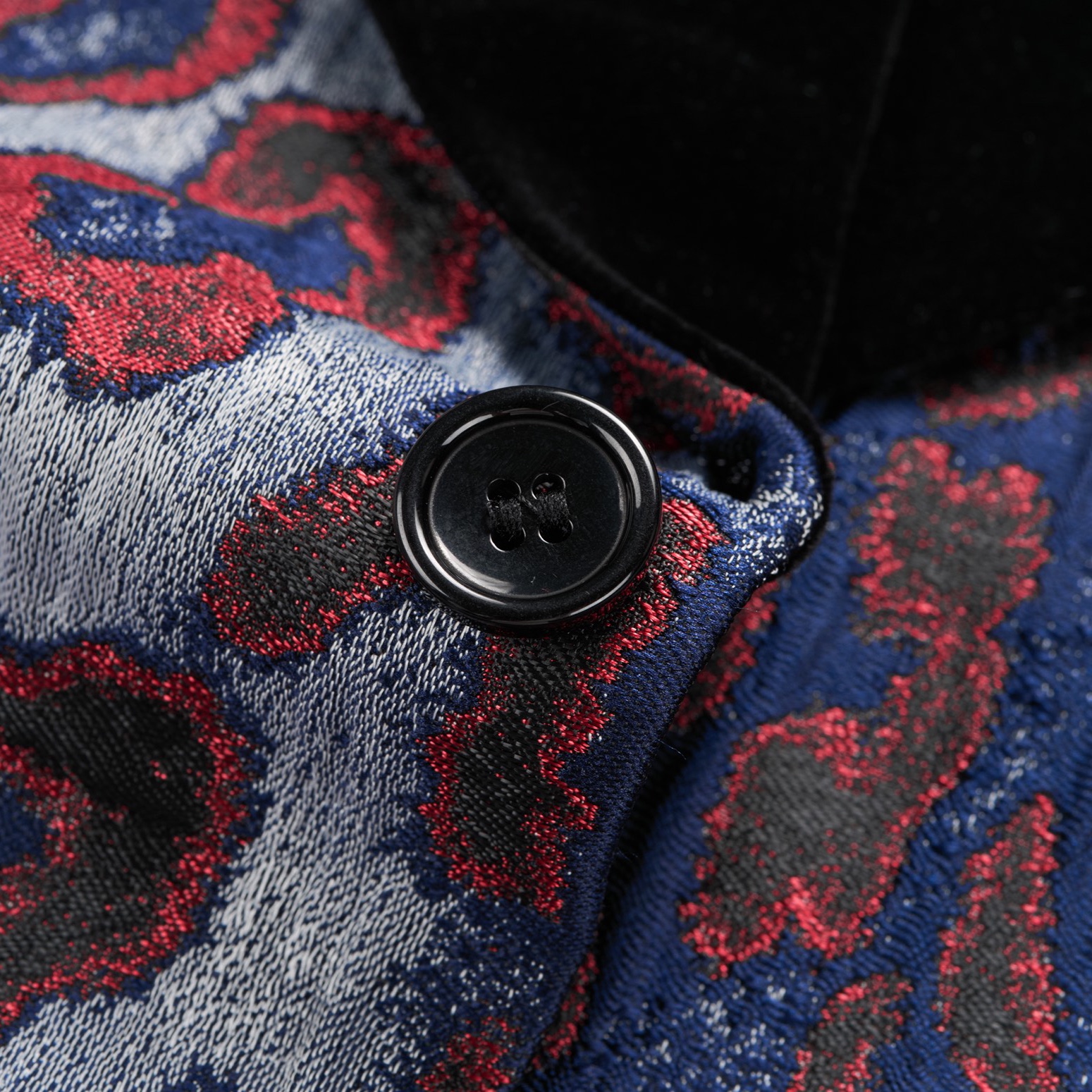 Front view of a men's red, blue, and silver leopard print jacquard blazer with a black velvet shawl lapel and a single-button