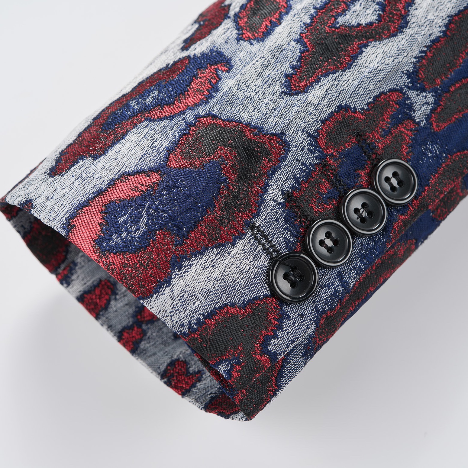 Front view of a men's red, blue, and silver leopard print jacquard blazer with a black velvet shawl lapel and a single-button