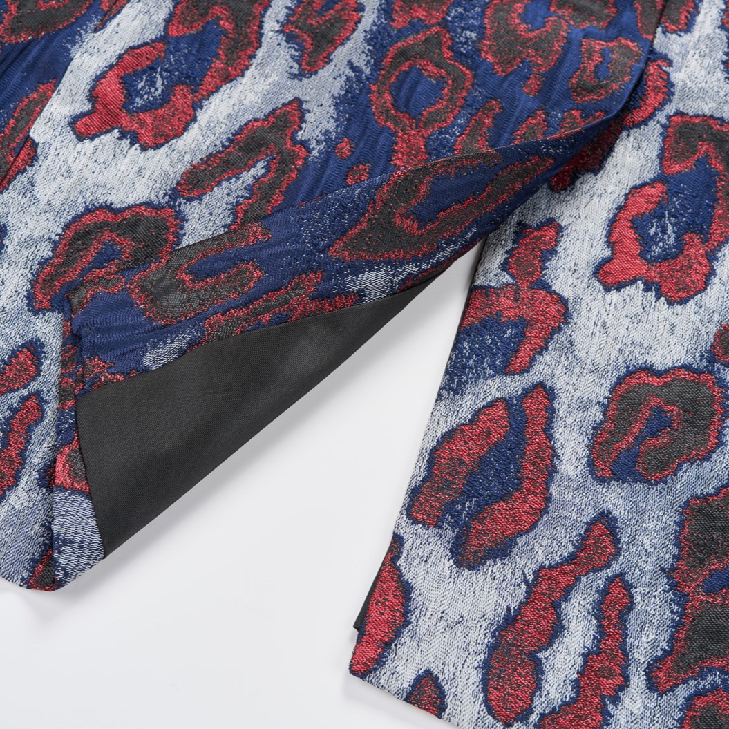 Front view of a men's red, blue, and silver leopard print jacquard blazer with a black velvet shawl lapel and a single-button