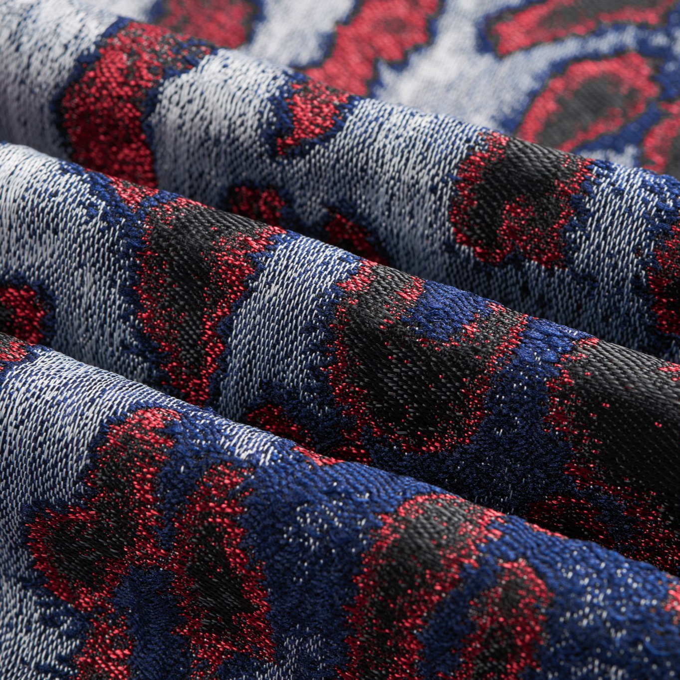 Front view of a men's red, blue, and silver leopard print jacquard blazer with a black velvet shawl lapel and a single-button