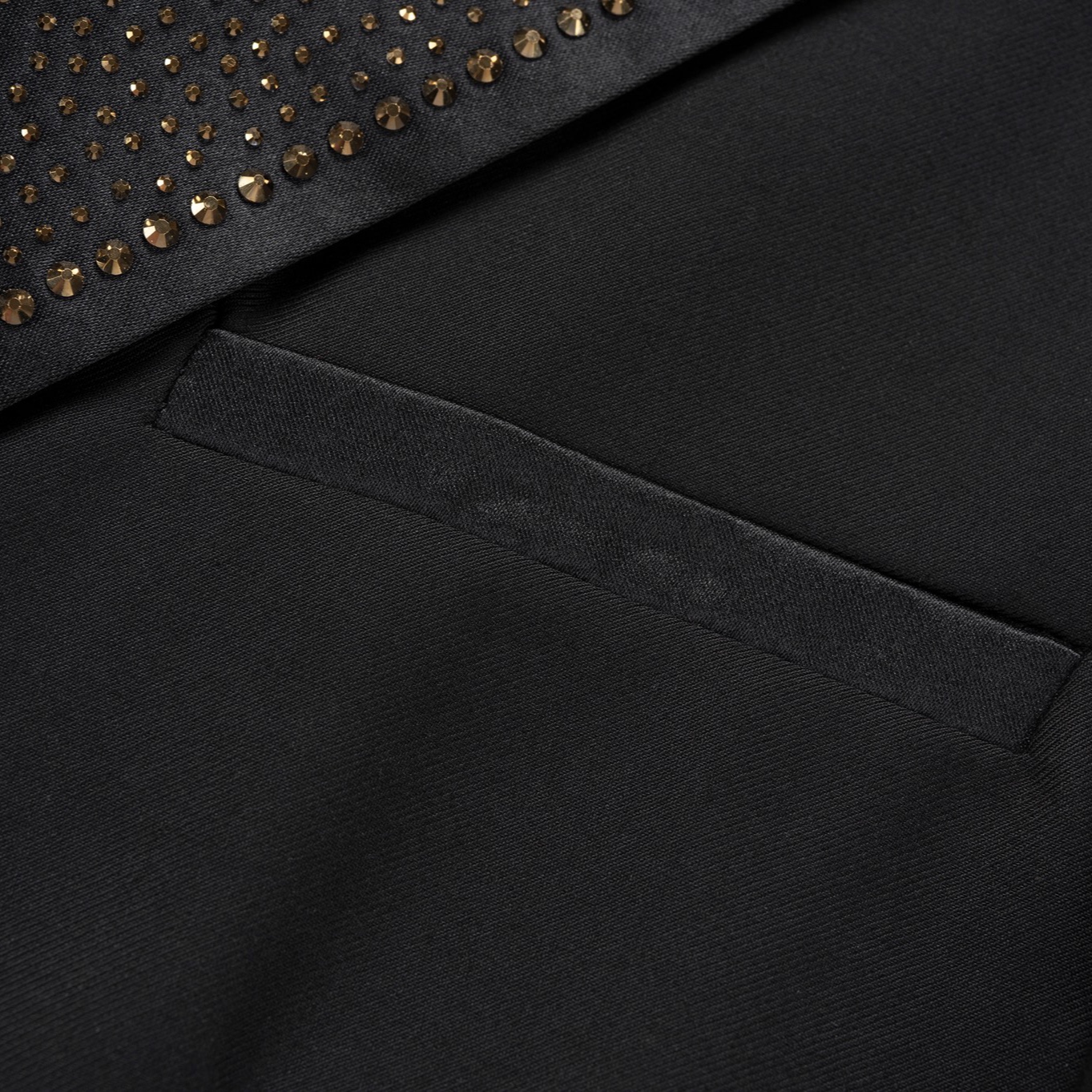 Front view of a men's black slim fit 3-piece suit with gold sequin lapels and pocket trim, including blazer, vest, and