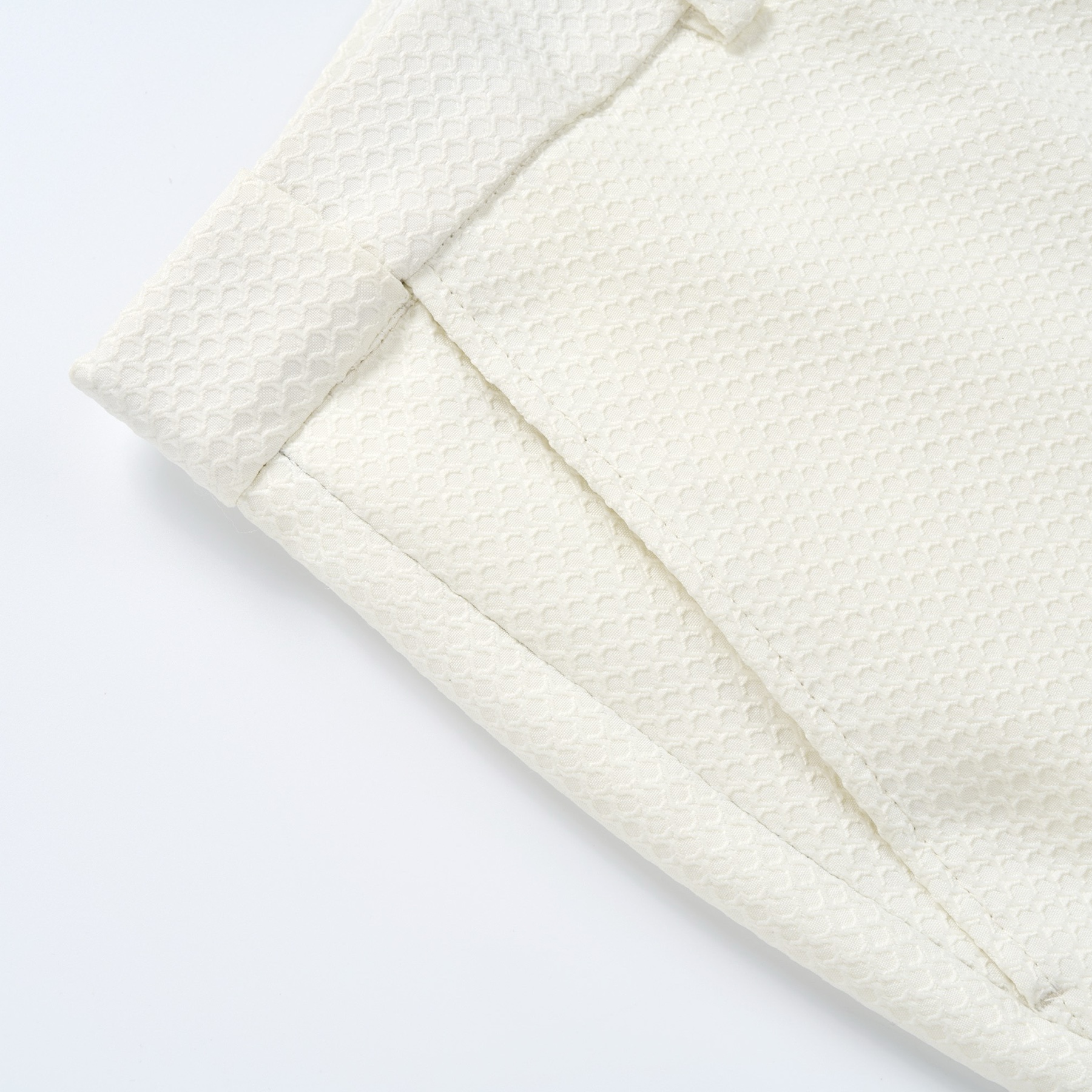 Front view of a Doohoob men's white textured double-breasted suit with shawl lapel and matching trousers.