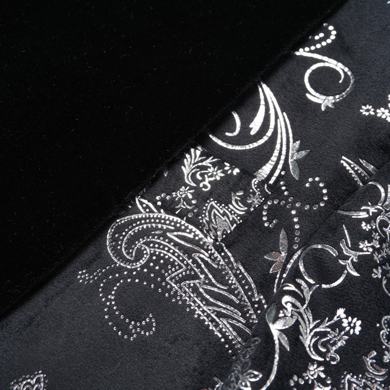 Front view of a men's black blazer with silver paisley pattern and black velvet shawl lapel.