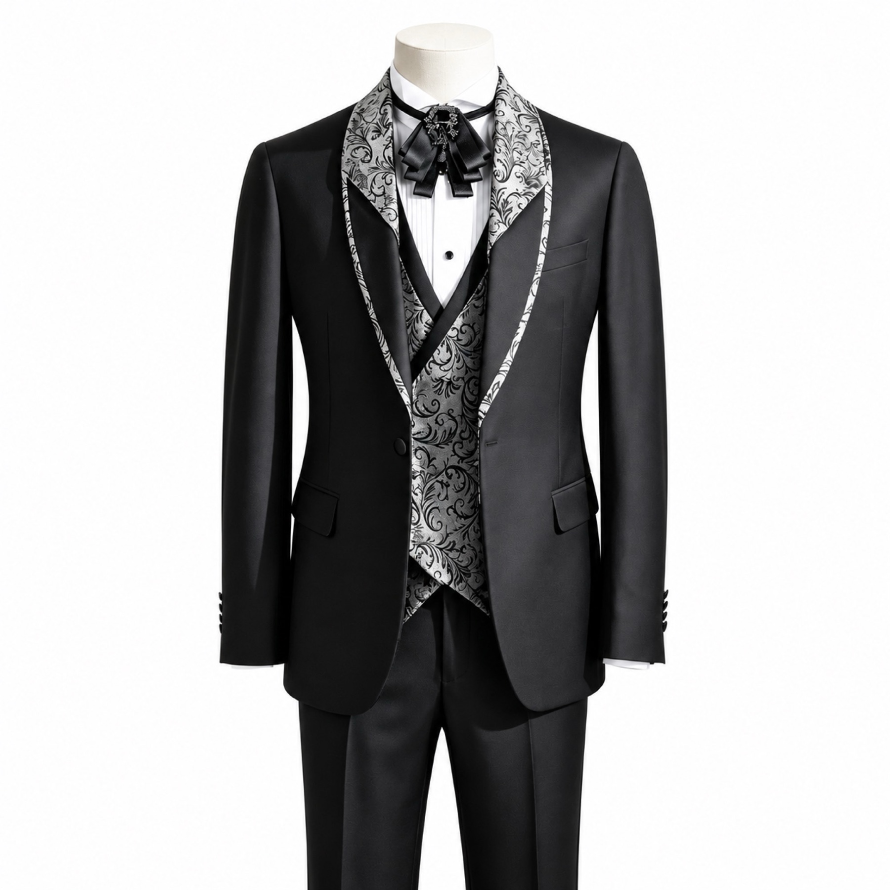 Black men's 3-piece tuxedo suit with silver and black patterned shawl lapel and matching vest, worn on a mannequin.