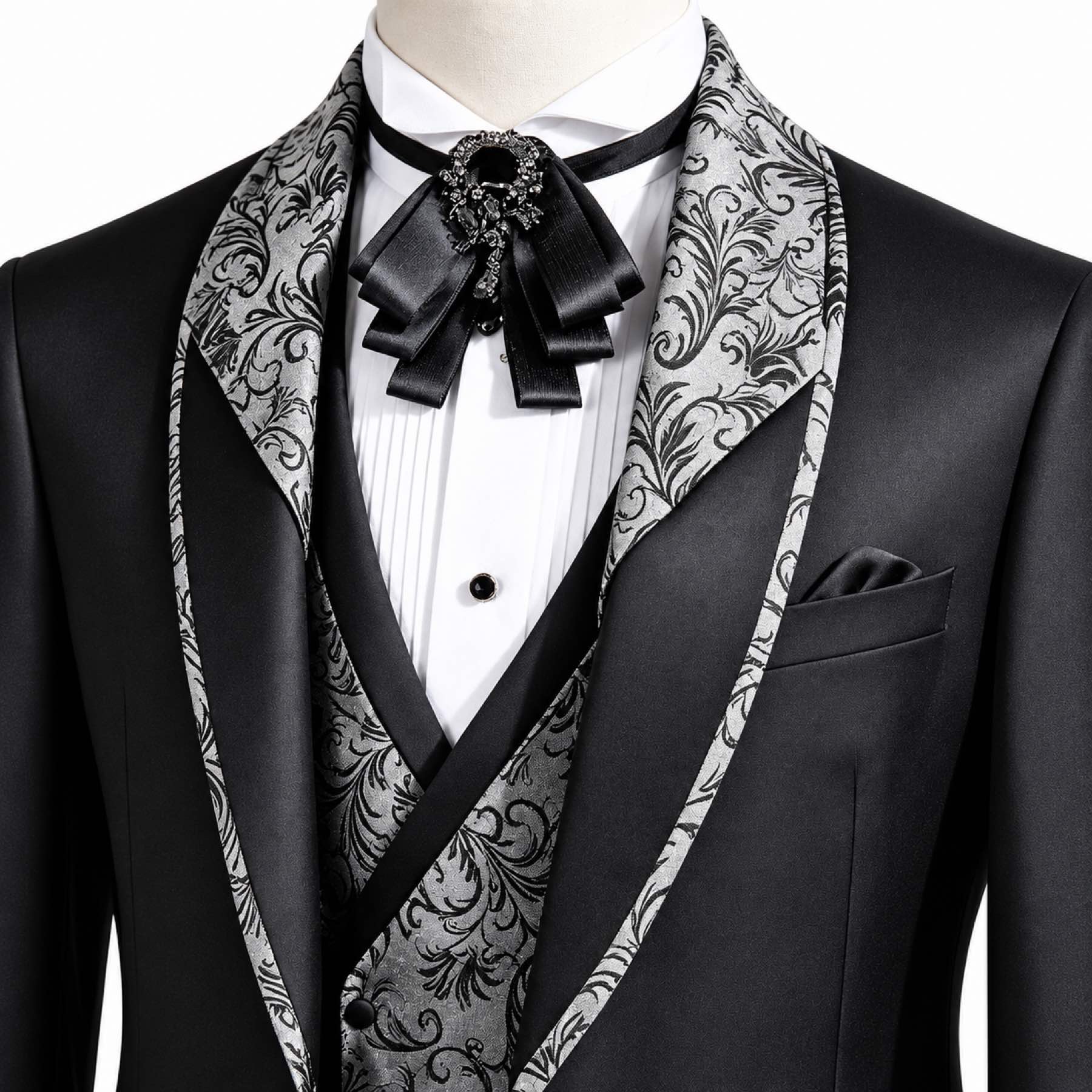 Black men's 3-piece tuxedo suit with silver and black patterned shawl lapel and matching vest, worn on a mannequin.