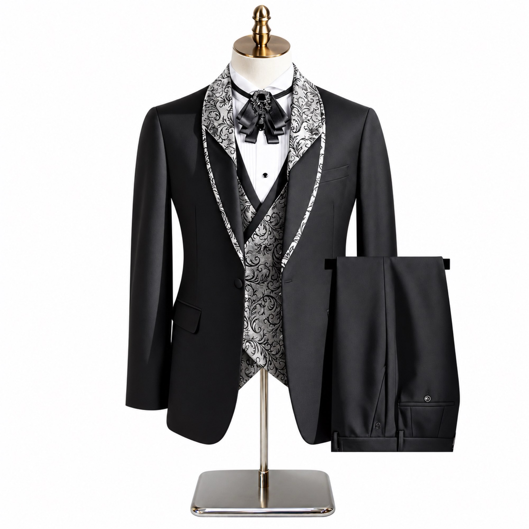 Black men's 3-piece tuxedo suit with silver and black patterned shawl lapel and matching vest, worn on a mannequin.