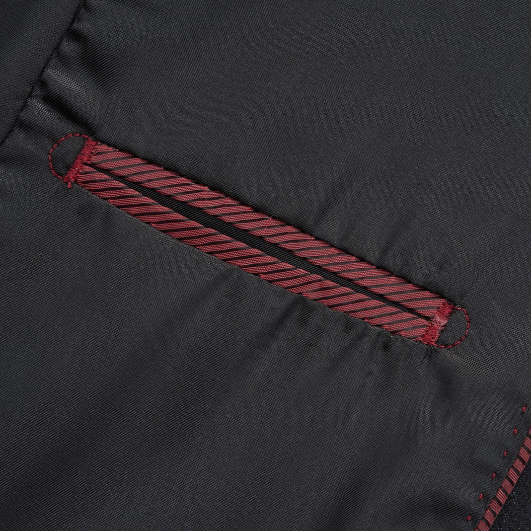 Close-up of a men's black and white striped double-breasted suit with peak lapels and button details.