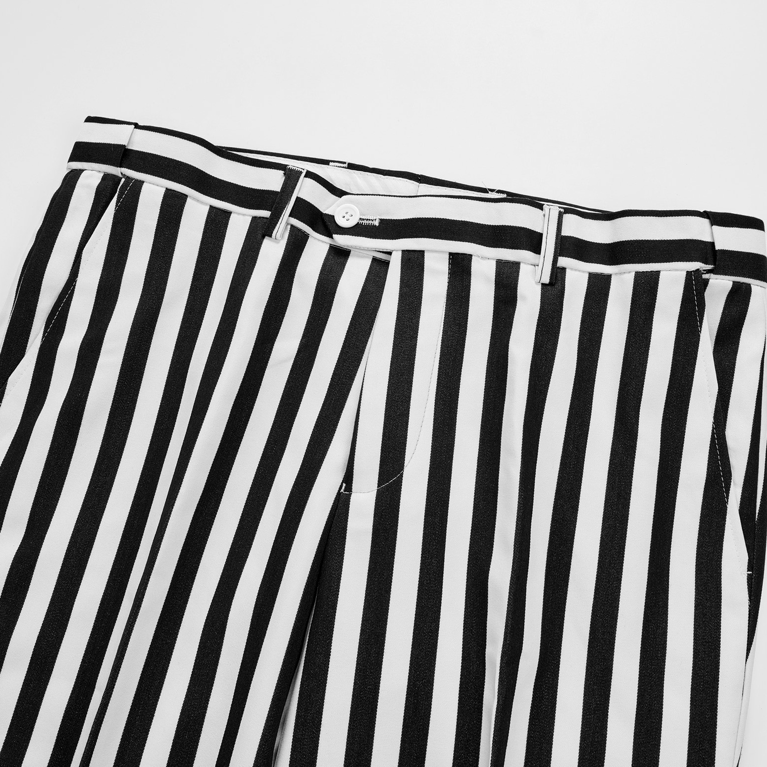 Close-up of a men's black and white striped double-breasted suit with peak lapels and button details.