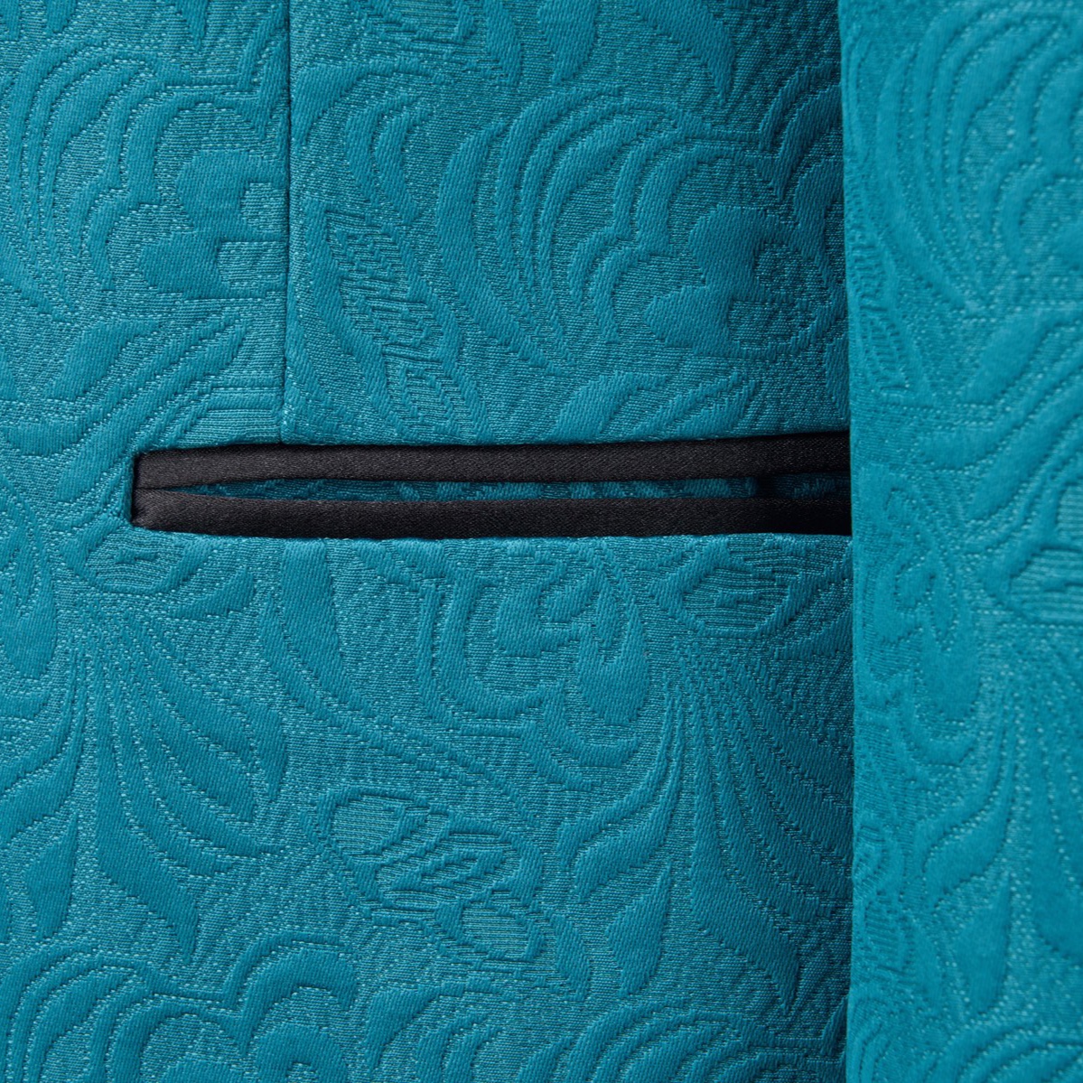 Full view of a men's teal jacquard double-breasted suit with black shawl lapel and matching trousers.