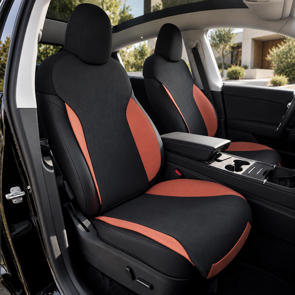 Black and orange suede seat covers on the front seats of a Tesla Model Y Juniper