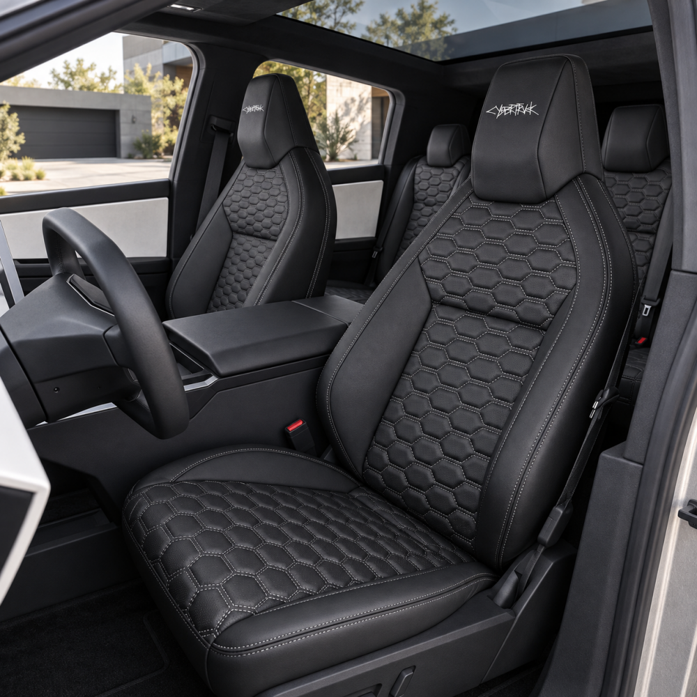 Black hexagonal-quilted seat covers installed in a Tesla Cybertruck 2024+ cabin