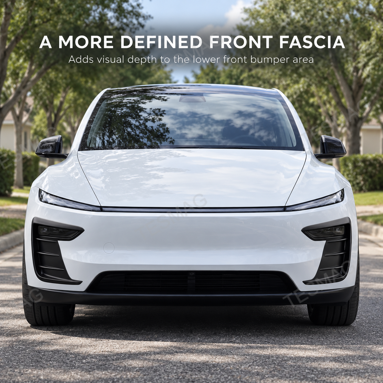 Front view of white Model Y Juniper with black bumper accent trim installed