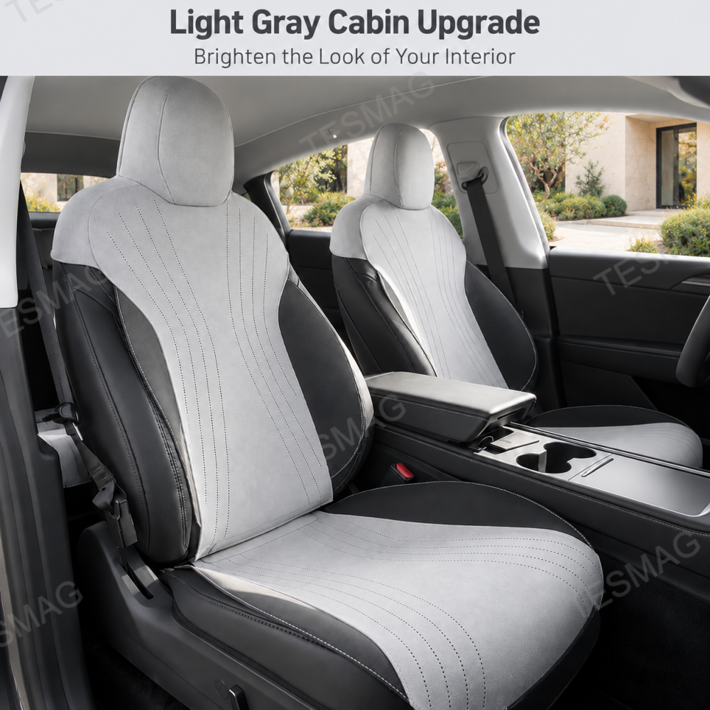 Light gray suede front seat covers installed in a Tesla Model Y Juniper cabin