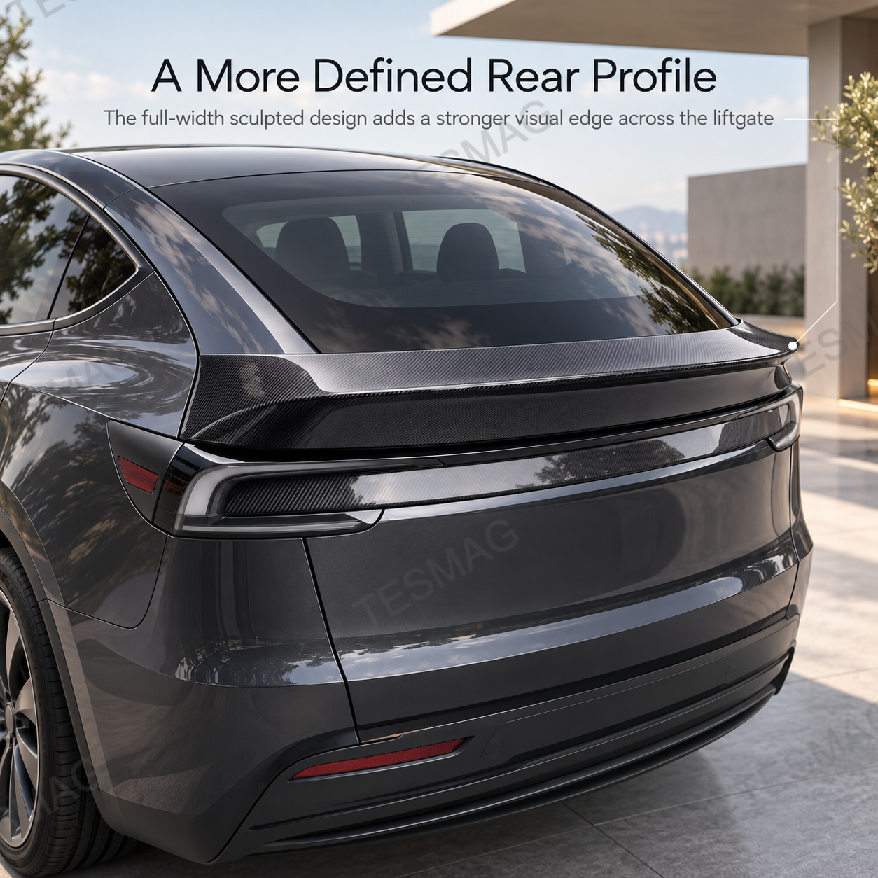 Model Y Juniper rear with carbon fiber spoiler showing a more defined trunk profile