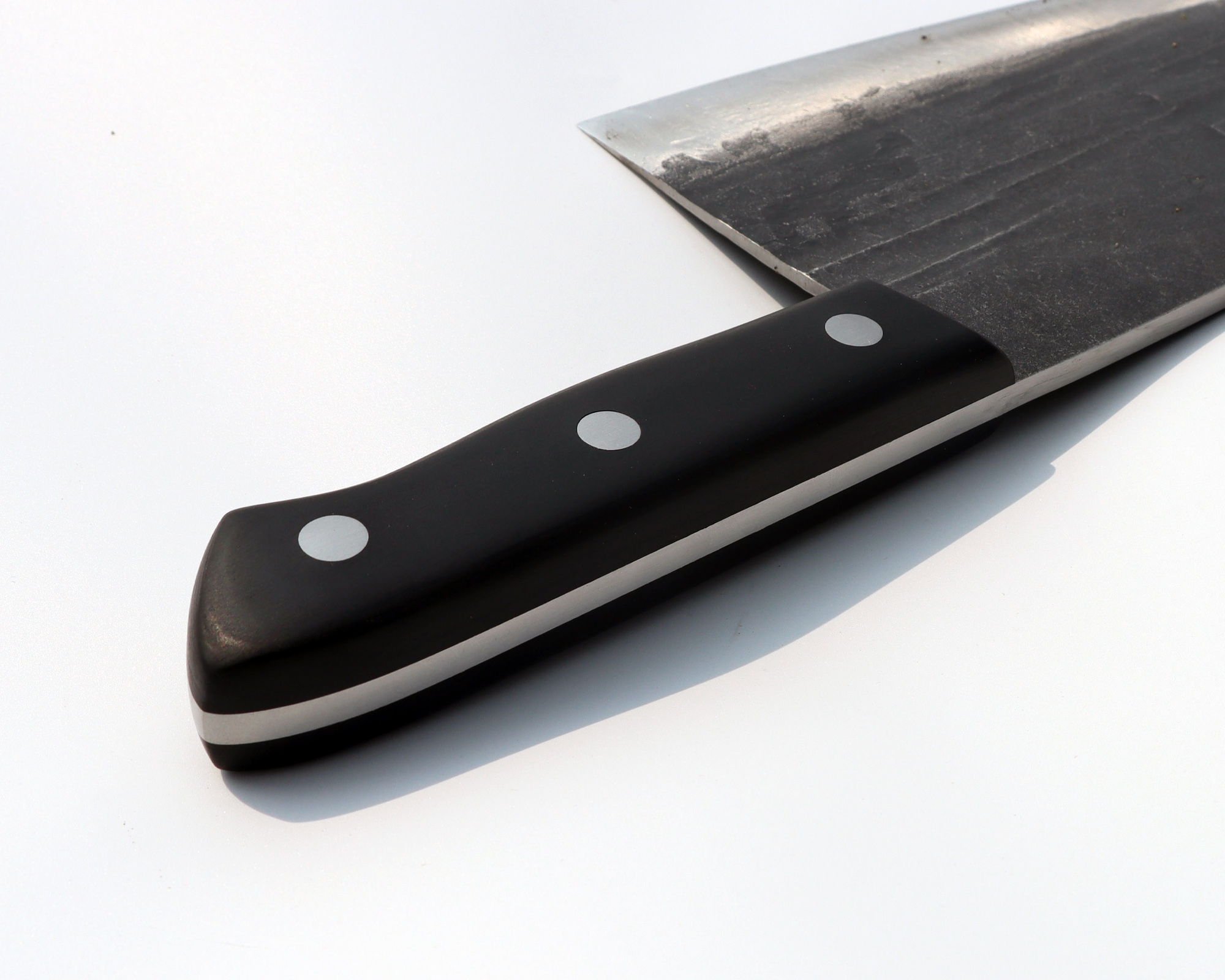 full tang construction and triple riveted black wood handle