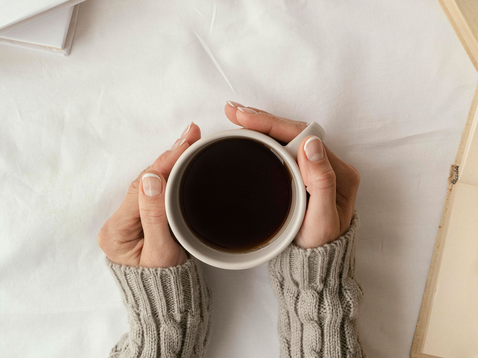 close up hands holding coffee cup