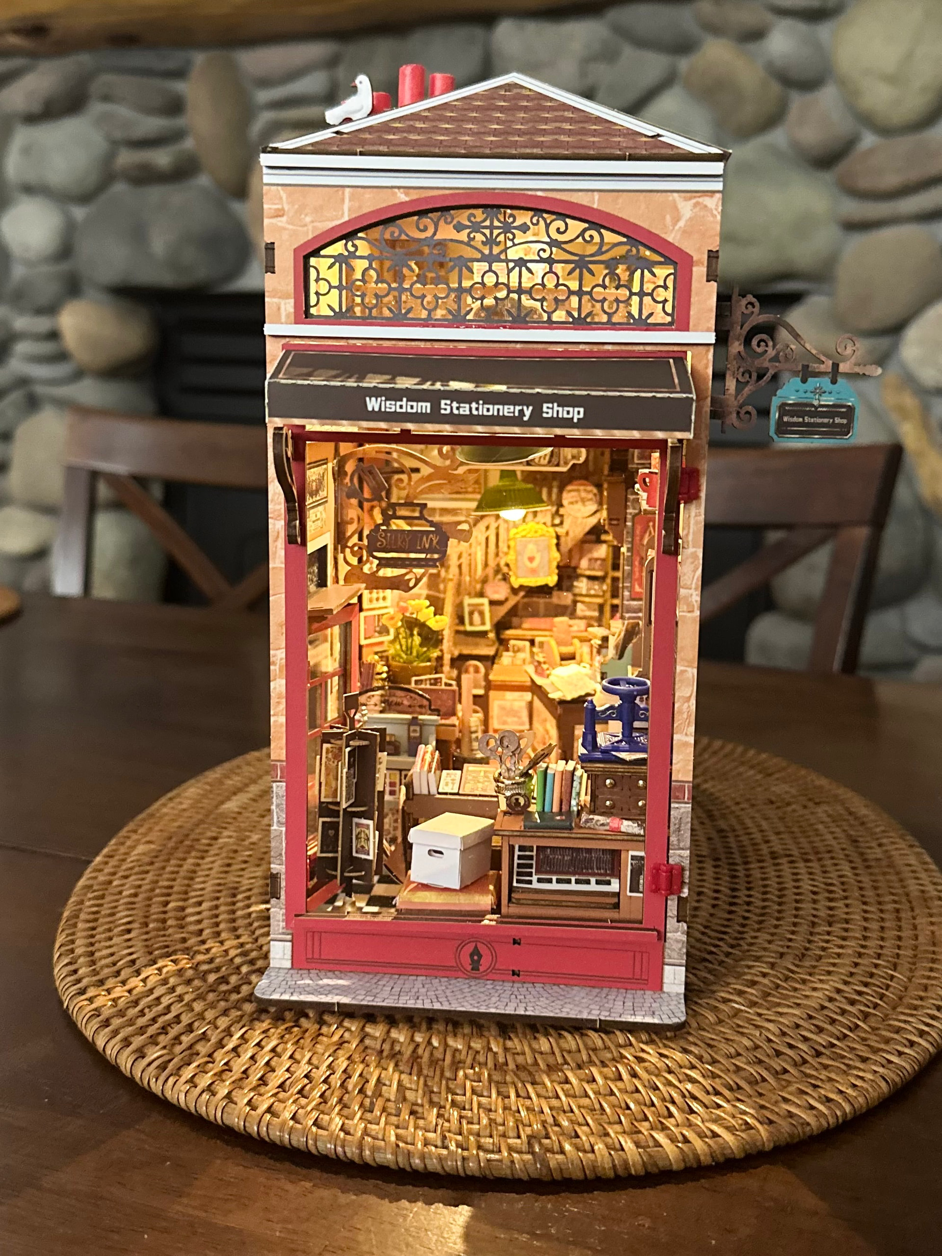 Completed Wisdom Stationery Shop glowing warmly, photographed by community maker mchipman