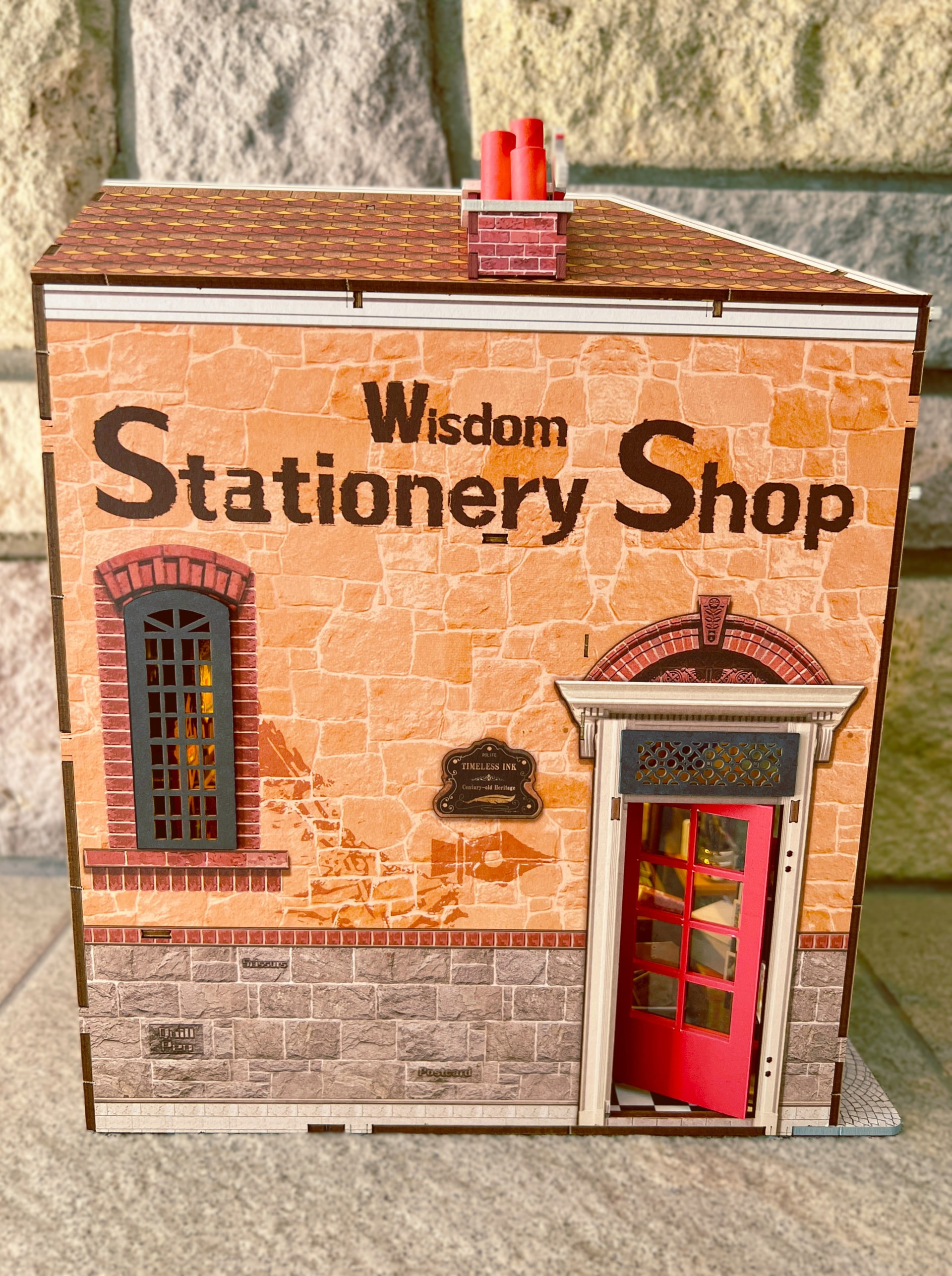 Side view of Wisdom Stationery Shop with its red entrance open, photographed by JDisaduck