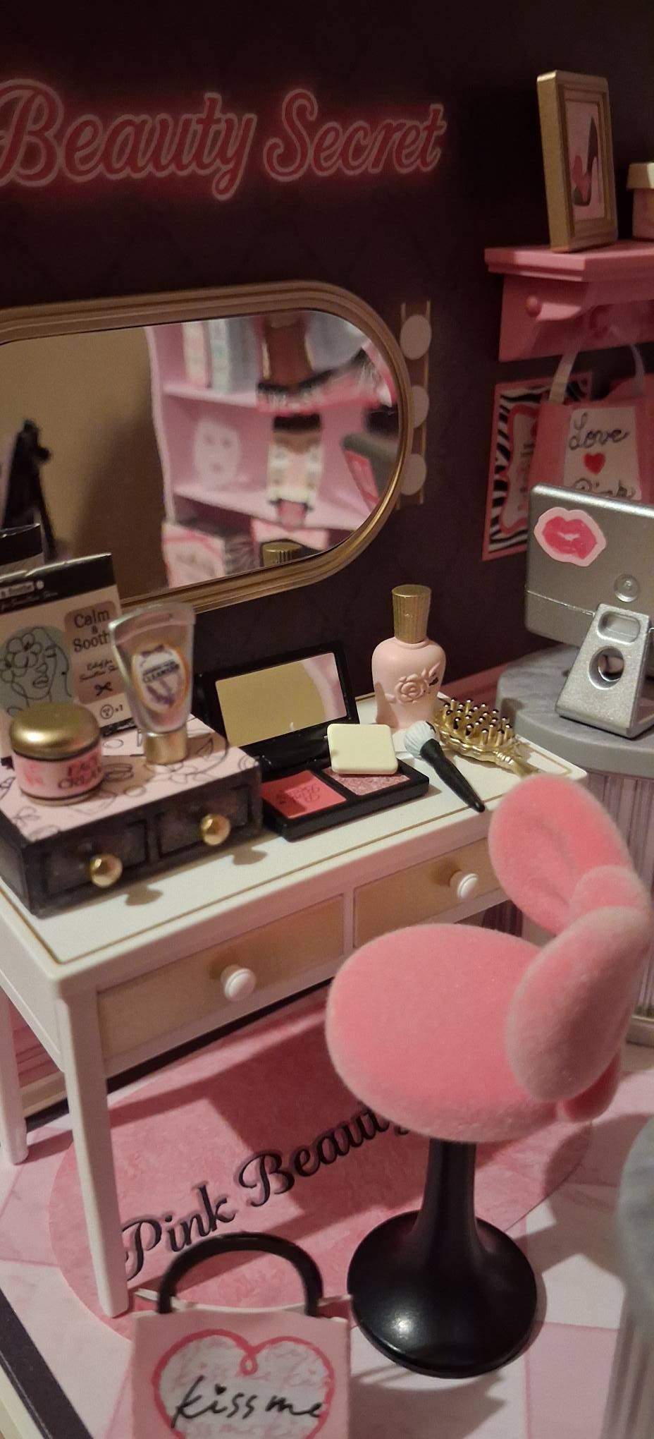 Customized Pink Beauty Secret display with a figure and optional enclosure, photographed by Nita Davis