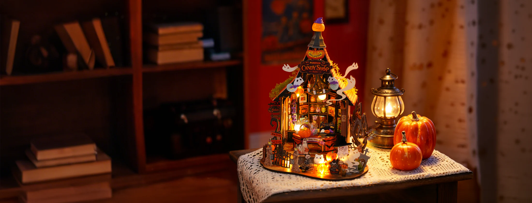 Rolife Haunted Candy House DG186 illuminated in a wide Halloween room scene
