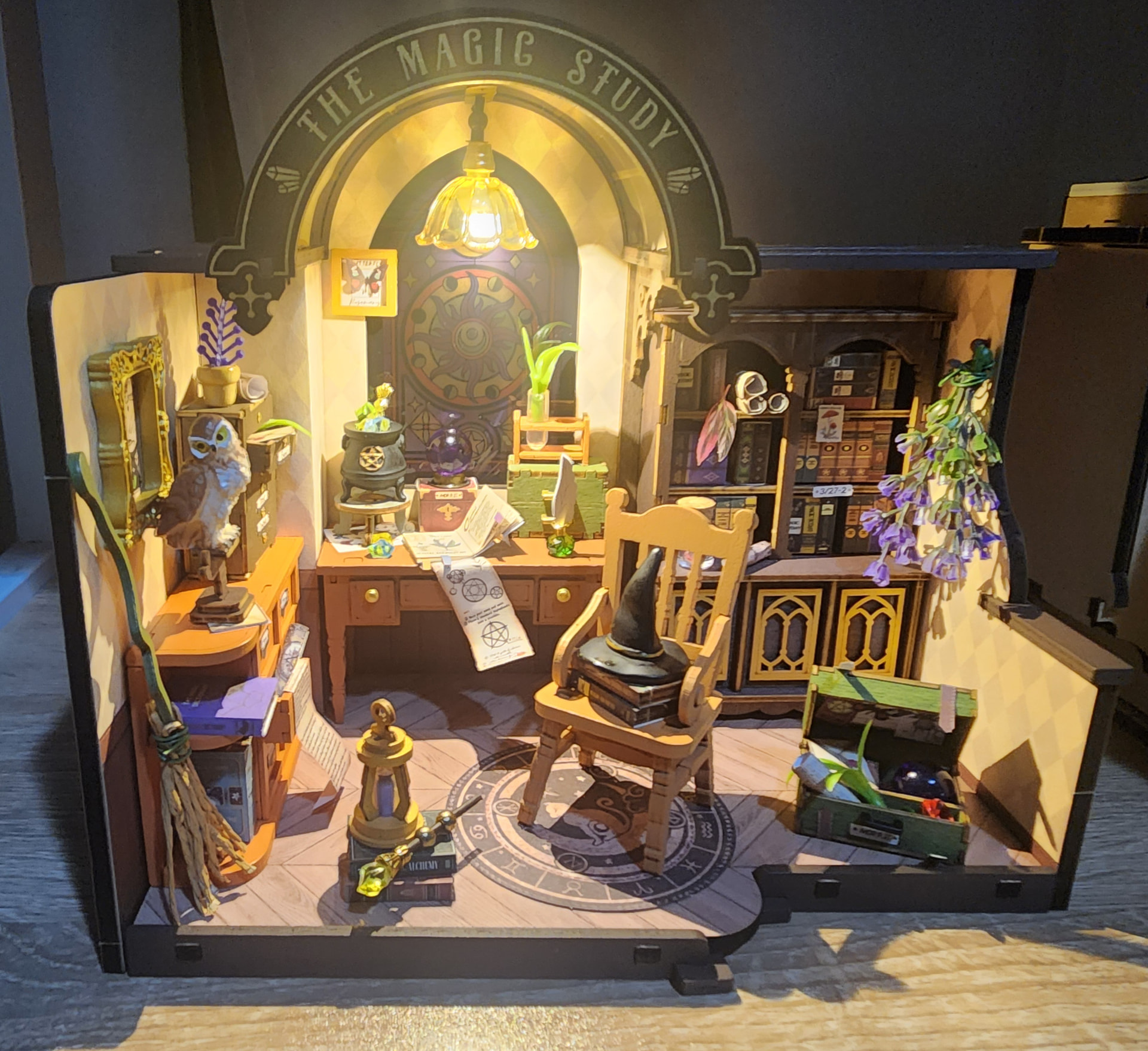 Rolife Community maker Pola's illuminated The Magic Study DG166 with books, a stained-glass window, and study furniture